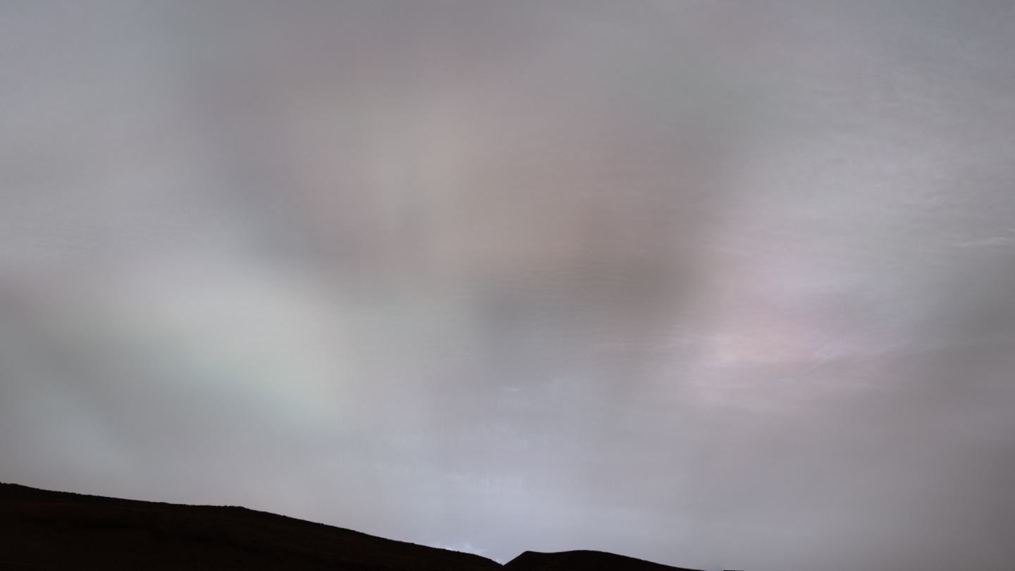 Sun rays shining through clouds at sunset on Mars.