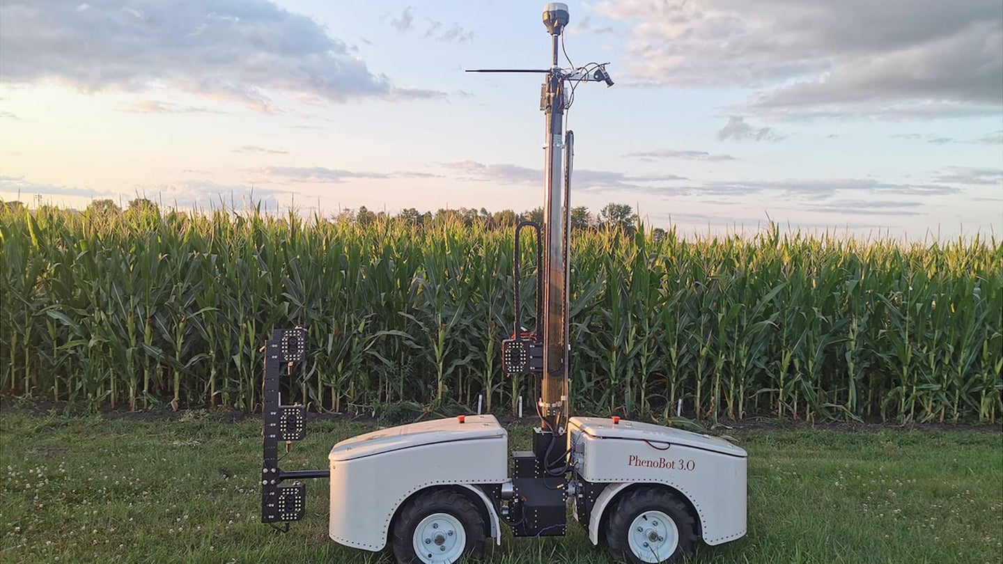 Corn stalk leaf measuring robot parked in front of field
