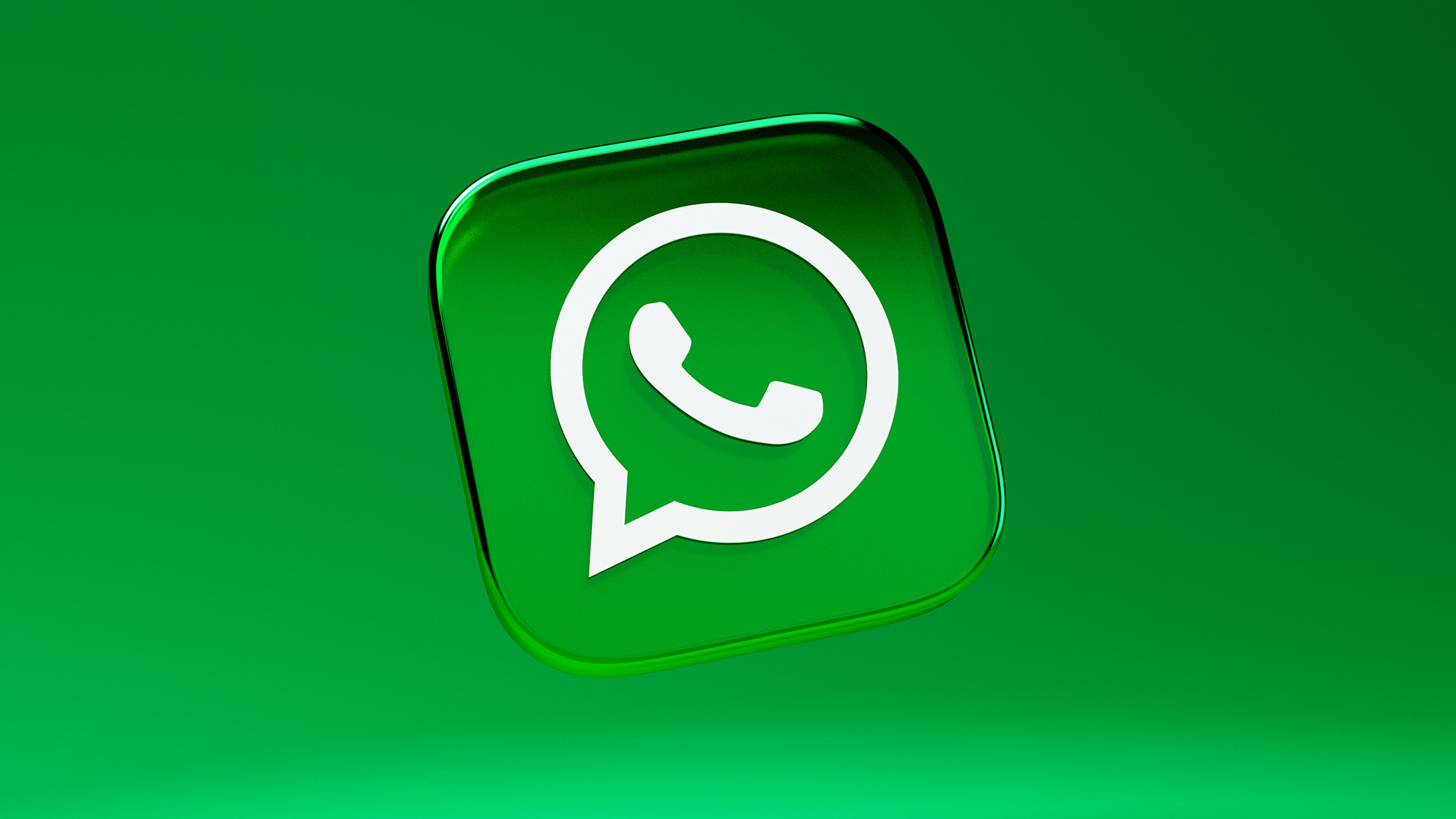 Render of a WhatsApp logo seemingly made out of plastic bouncing in front of a green backdrop.