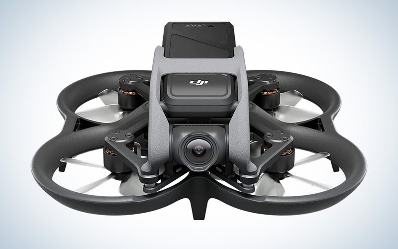 The DJI avata drone by itself with the camera facing forward on a plain background