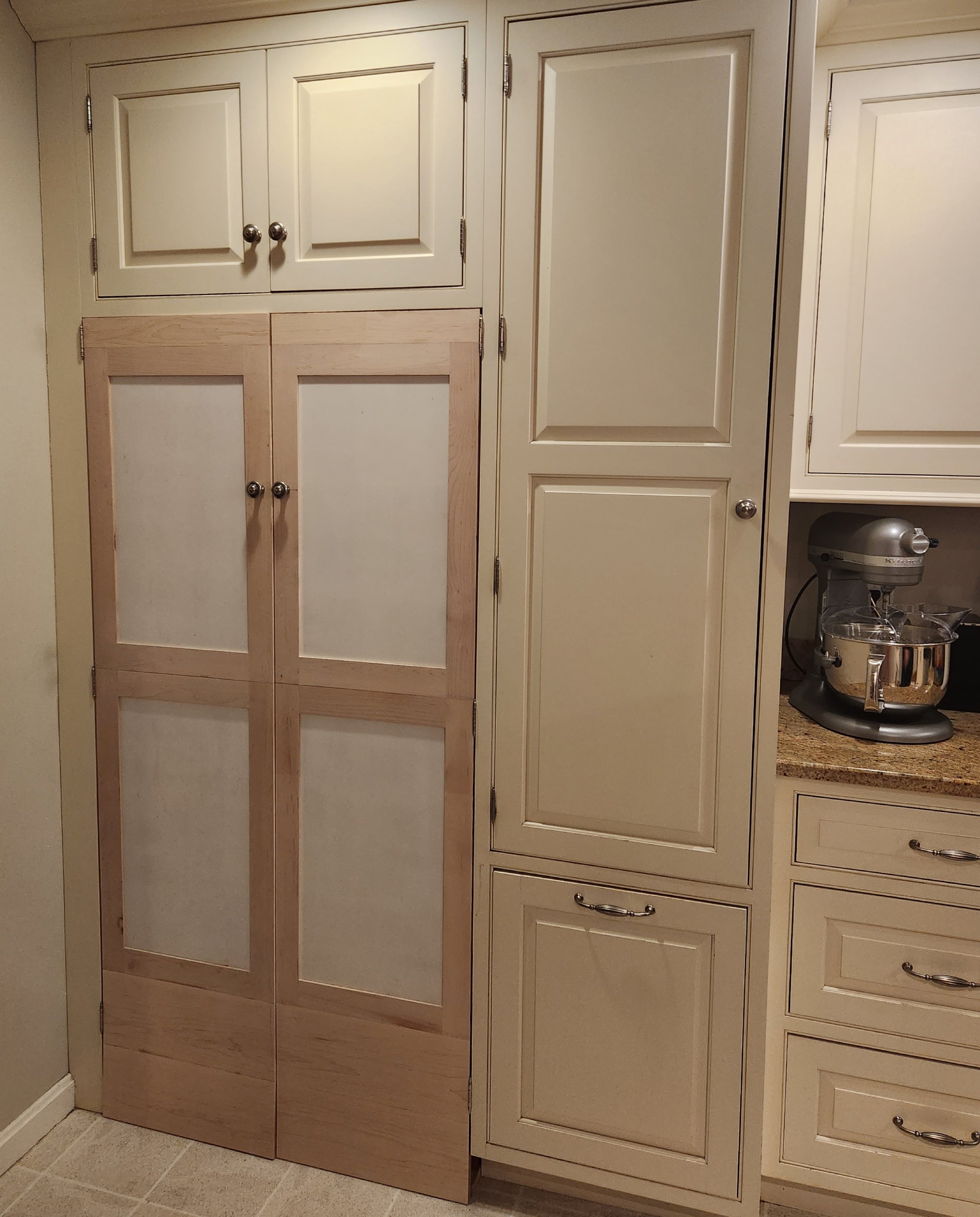 Homemade pantry doors in a kitchen.