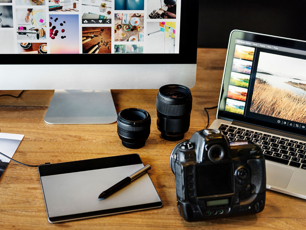 A lineup of photo items on a desk.