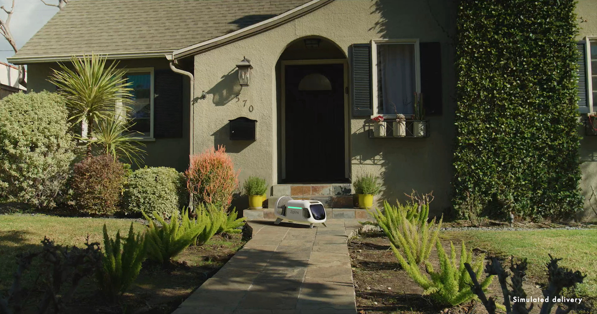 This drone company plans to make deliveries by lowering a small droid into your yard