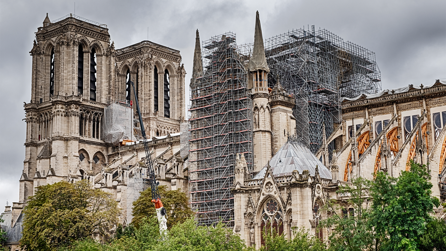 Notre Dame cathedral in Paris with scaffolding and construction work following a fire in 2019.
