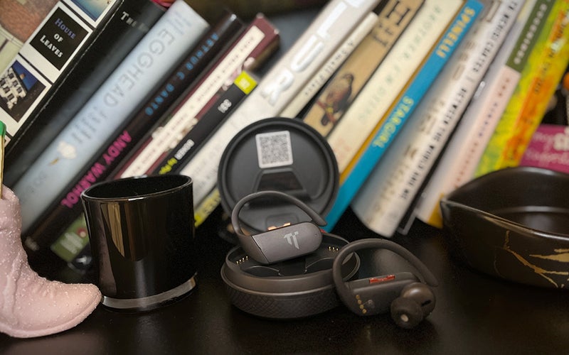 A pair of Dottir headphones on a bookshelf