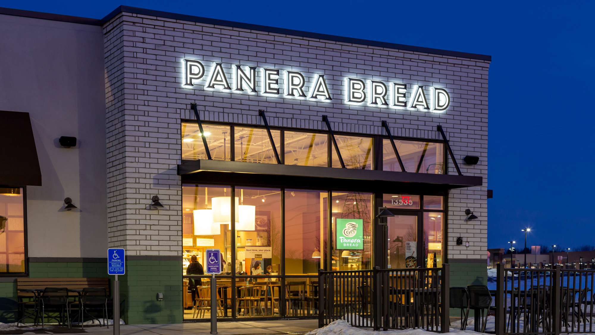 Panera Bread restaurant exterior at twilight