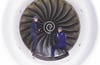 A Rolls-Royce turbofan engine with two men in blue coveralls in front of it.