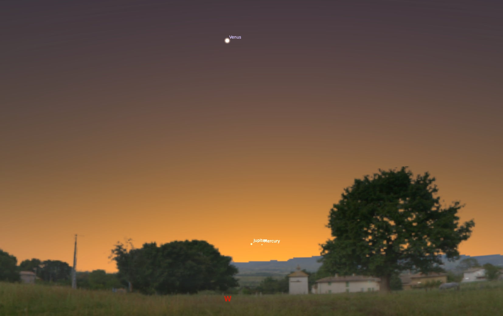 A sunset horizon, with Venus high up in the sky and Jupiter and Mercury low down, as they will appear in the planetary alignment on Tuesday, March 28, 2023.