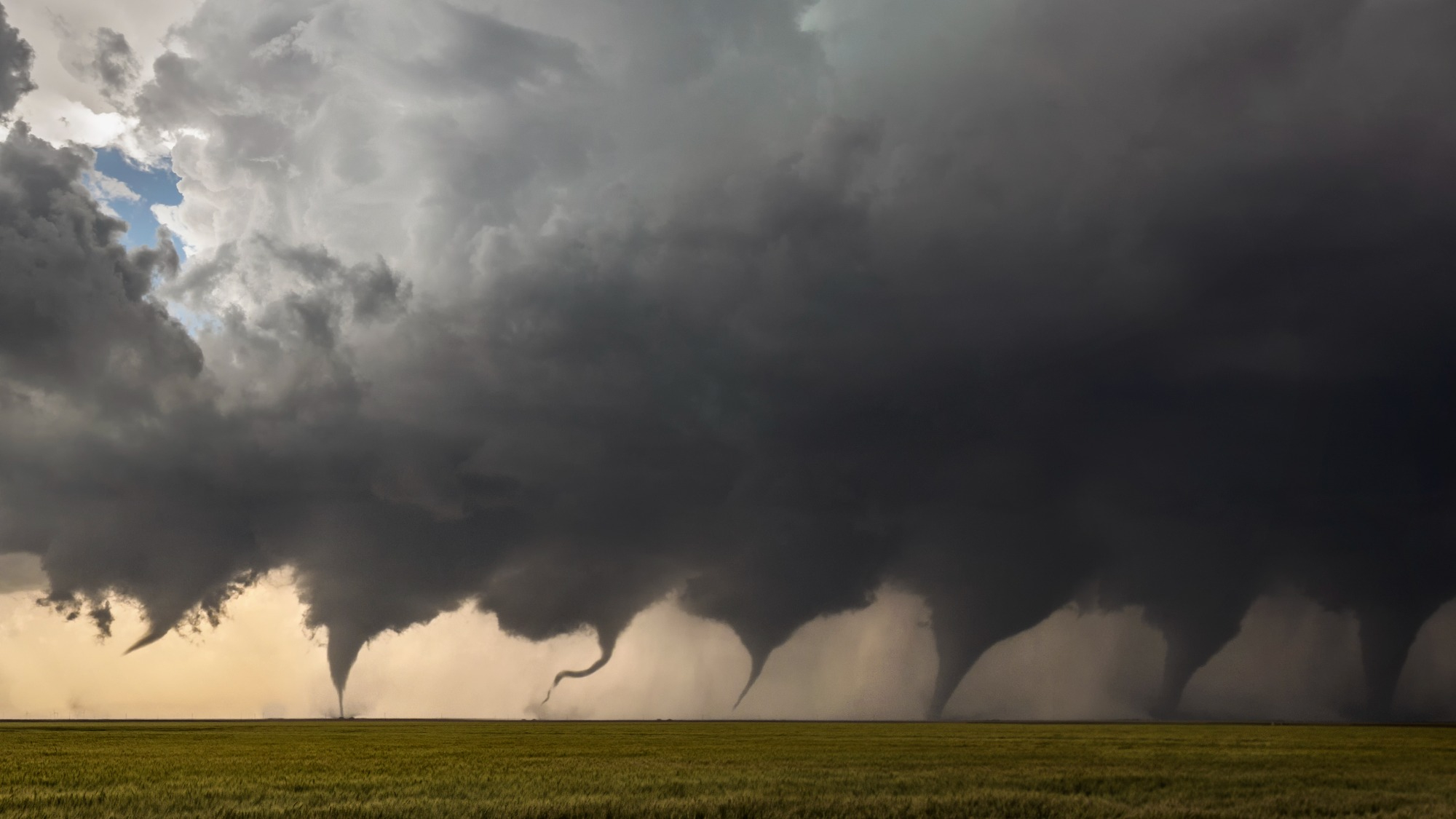 A series of images in this photo montage shows the evolution of a tornado.