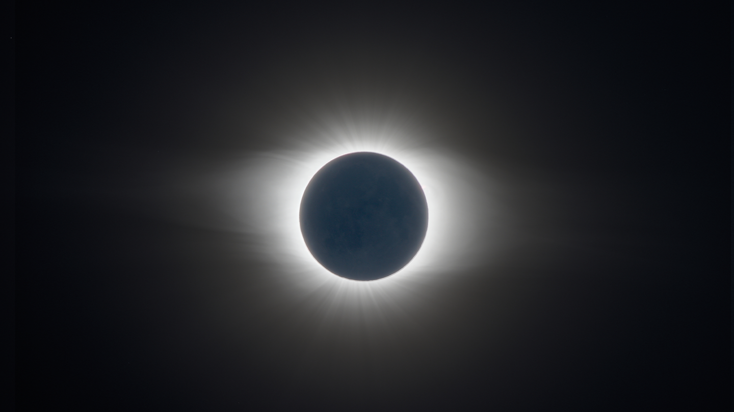 A total solar eclipse, a bright ring of sunlight around a dark moon on July 2, 2019.