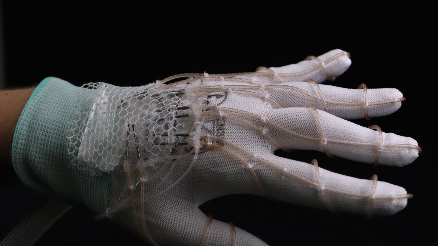 Hand wearing pumps woven into wearable glove