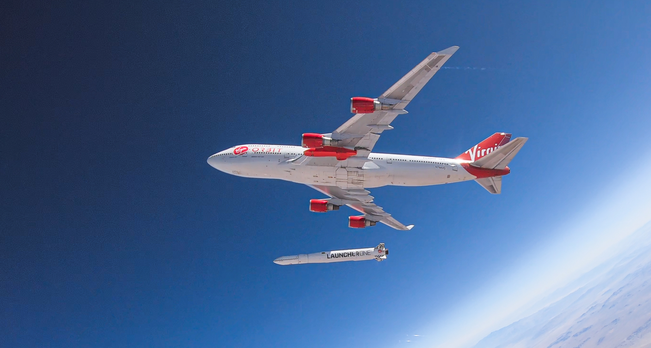 Rocket detaching from Virgin Orbit Boeing 747 jet