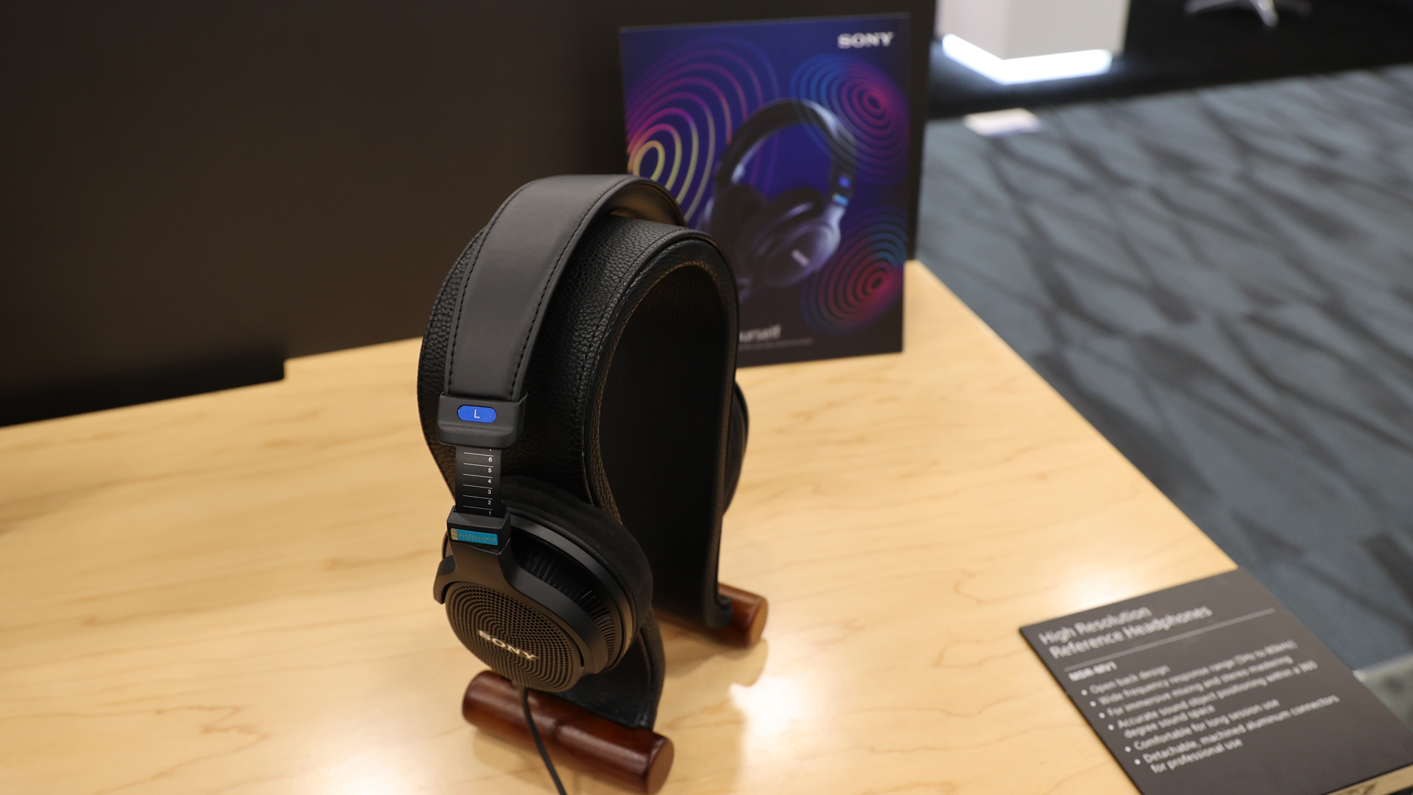 Sony MDR-MV1 headphones sitting on a table on a stand