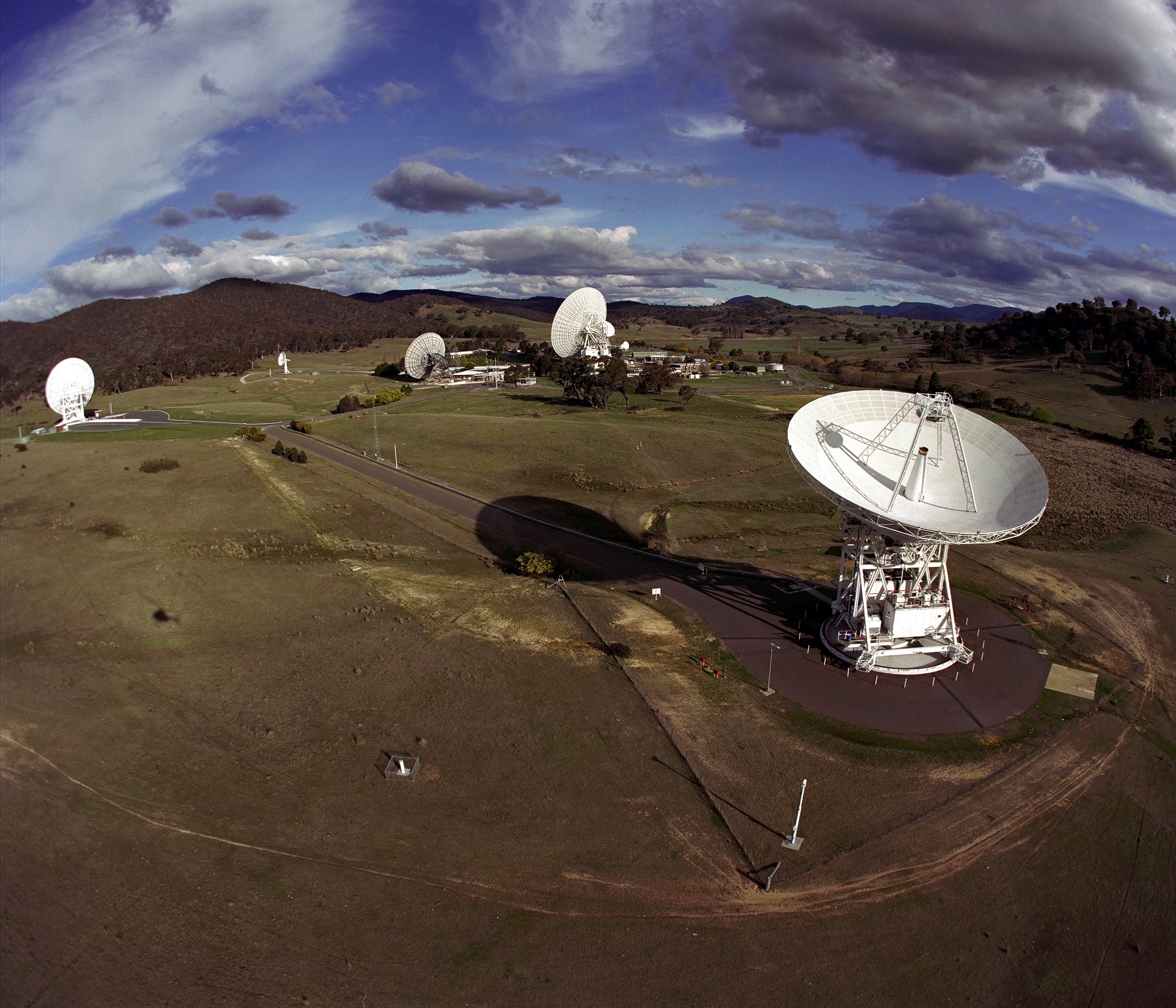 NASA Deep Space Network radiotelescopes on a grassy hill