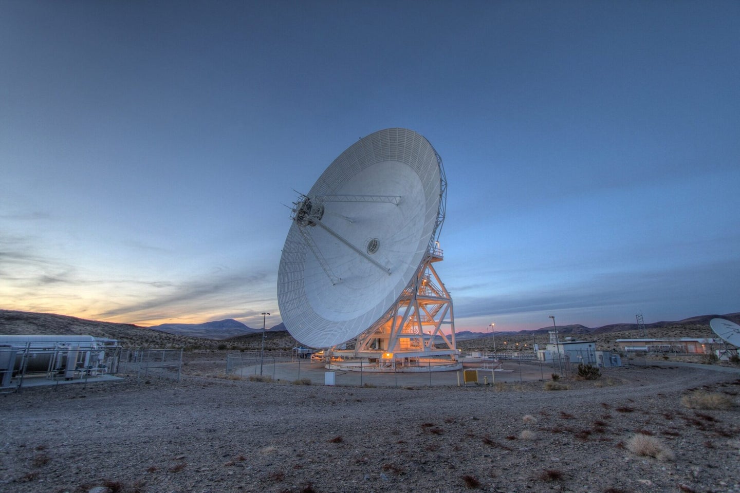 NASA Deep Space Network radiotelescope sending radio waves to spacecraft, stars, and maybe aliens