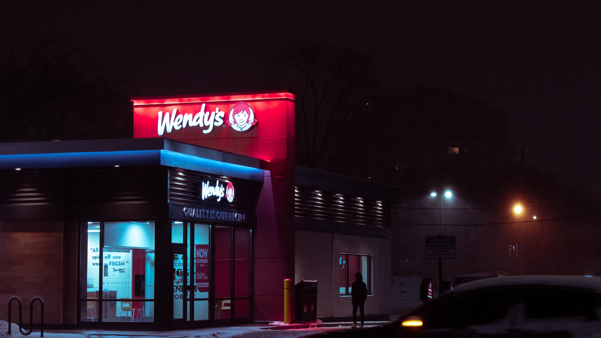 Wendy's chain restaurant at night.