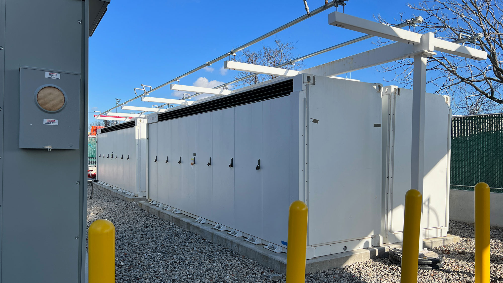 The four white units are the batteries, which can provide about three megawatts of power over four hours.