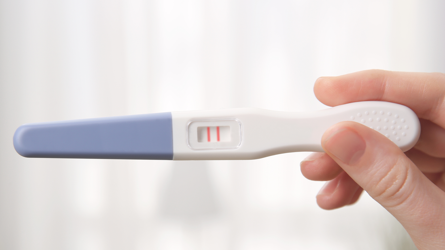 A positive pregnancy test.