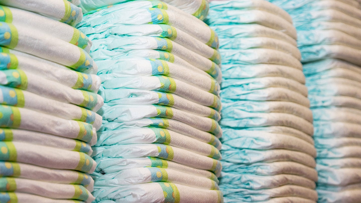 Close-up of children's diapers stacked in a piles