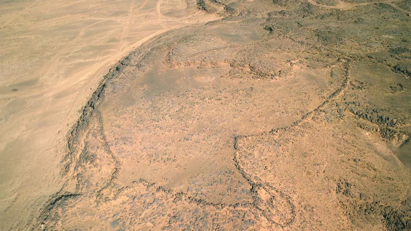 An aerial view of a desert kite in the Jebel az-Zilliyat region of Saudi Arabia. The kite dates back to the Stone Age and was a kind of hunting trap.