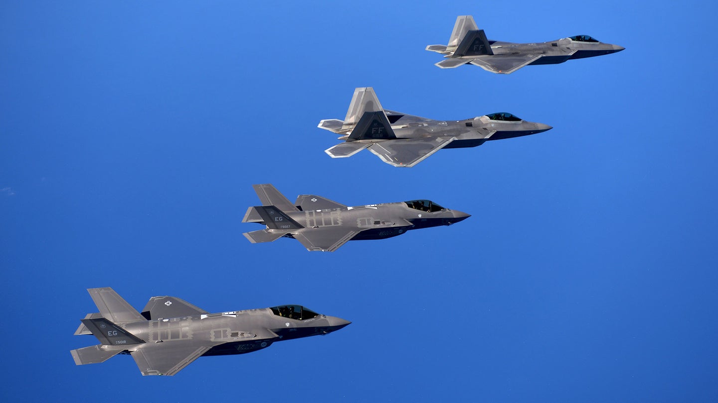 f-22 and f-35 fighter jets fly in formation