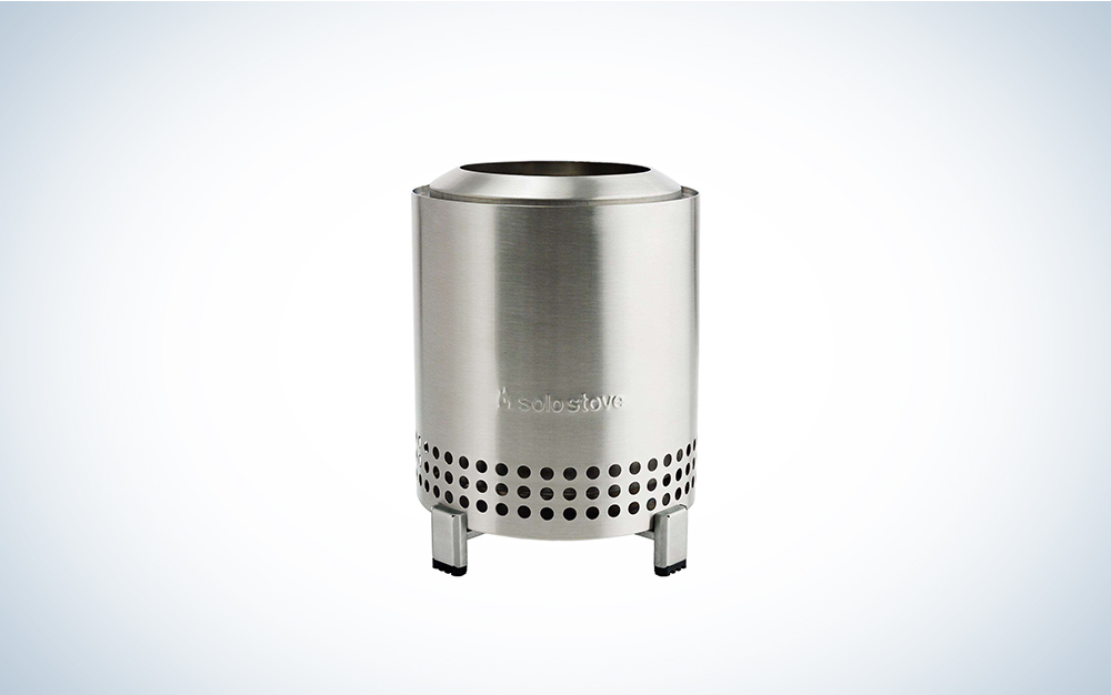 A stainless steel Solo Stove Mesa on a blue and white background