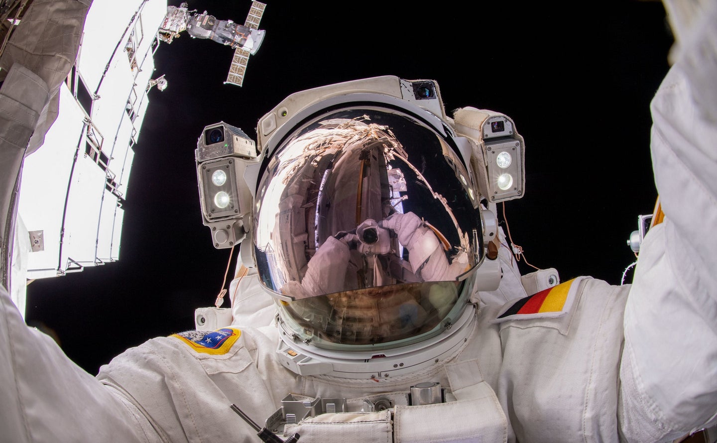 ISS astronaut taking selfie during space walk for social media