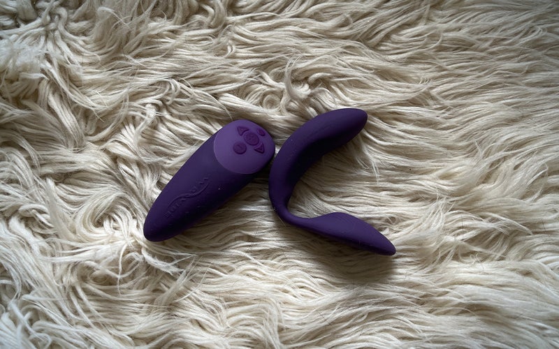 A purple We-Vibe Chorus on a white shag rug