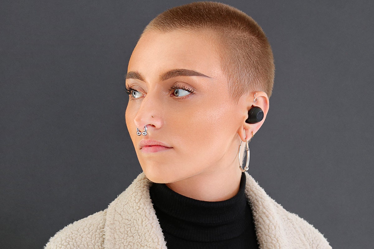 A person wearing wireless earbuds