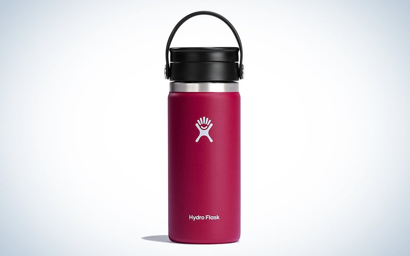A magenta Hydro Flask coffee travel mug on a blue and white background