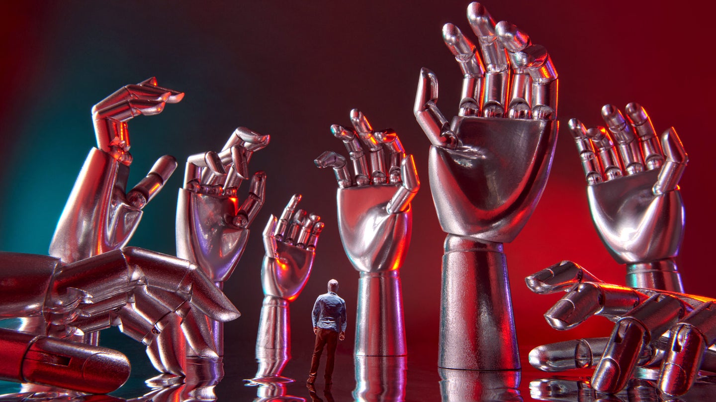A small human figure standing among many ominous metal robot hands reaching out of the ground like trees in a forest, everything bathed in red light.
