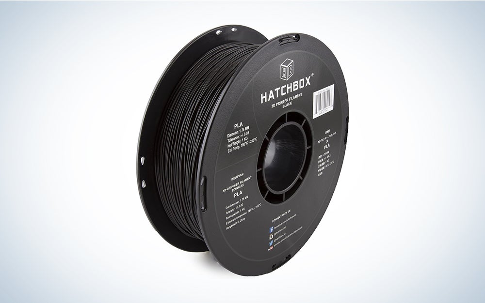 A black spool of Hatchbox 3D printer filament on a blue and white background