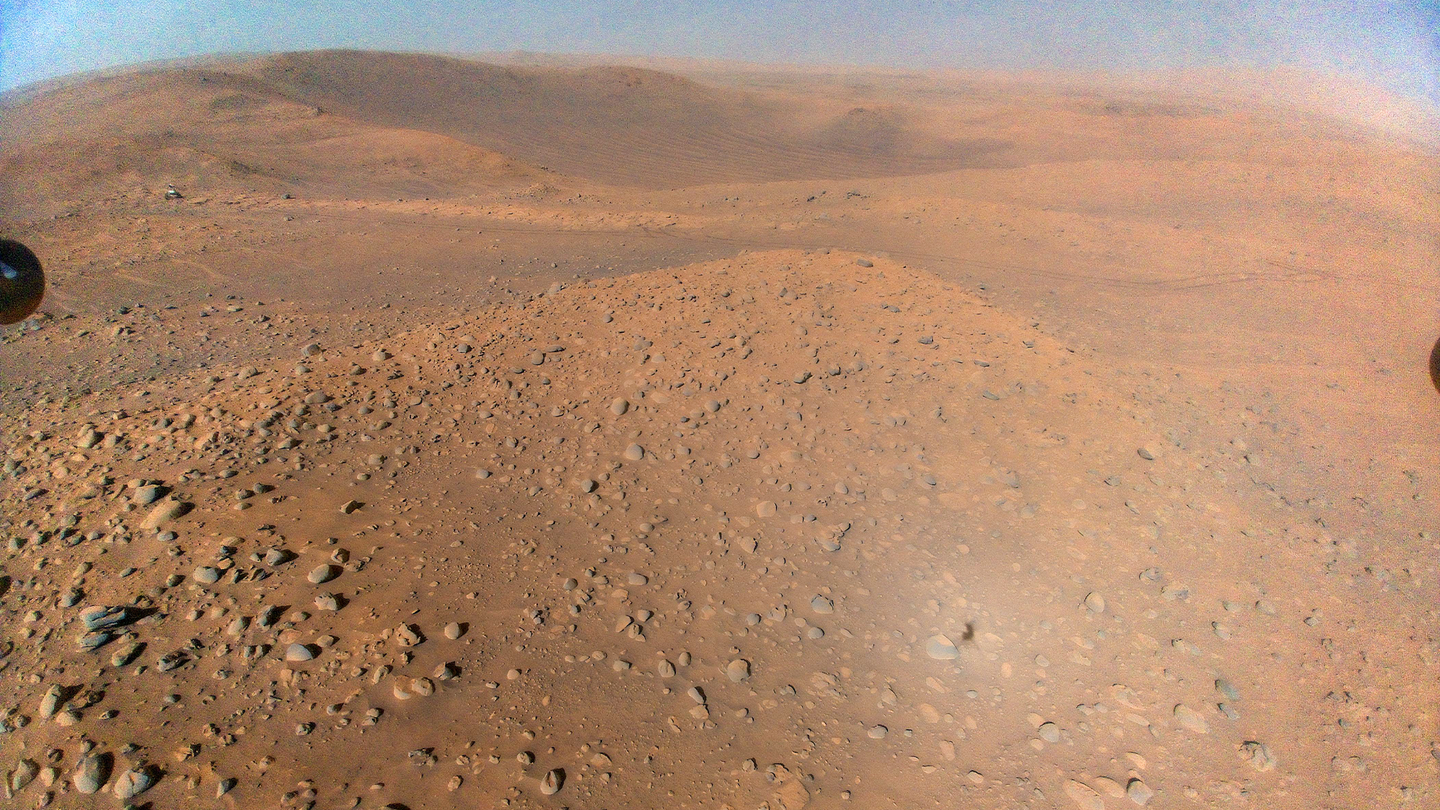 This image of NASA’s Perseverance Mars rover at the rim of Belva Crater was taken by the agency’s Ingenuity Mars Helicopter during the rotorcraft’s 51st flight on April 22, 2023, the 772nd Martian day, or sol, of the rover’s mission. At the time the image was taken, the helicopter was at an altitude of about 40 feet.