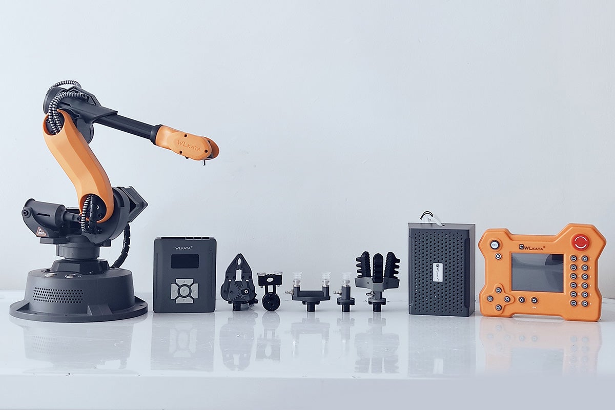 A robot arm and accessories on a white background