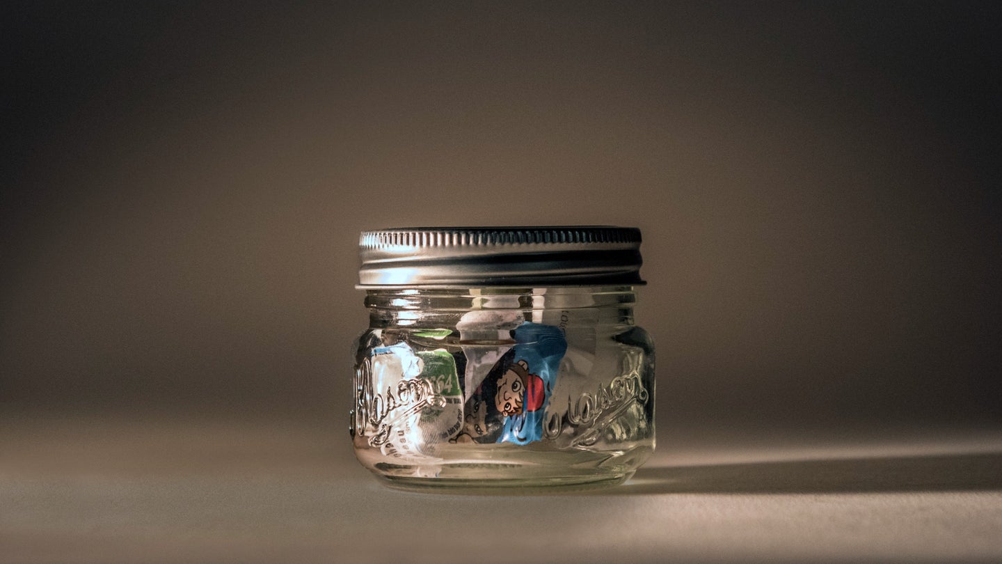 Jar filled with a week's worth of trash.