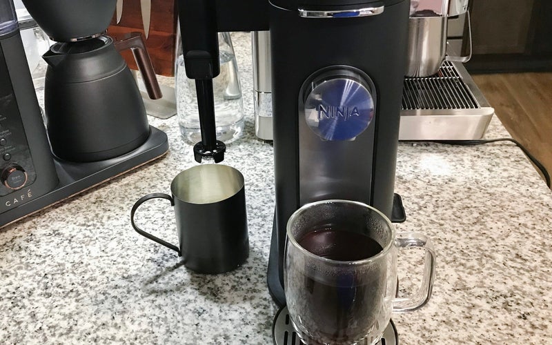 Ninja Pods & Grounds Single-Serve Coffee Maker drip coffee maker on a crowded kitchen counter