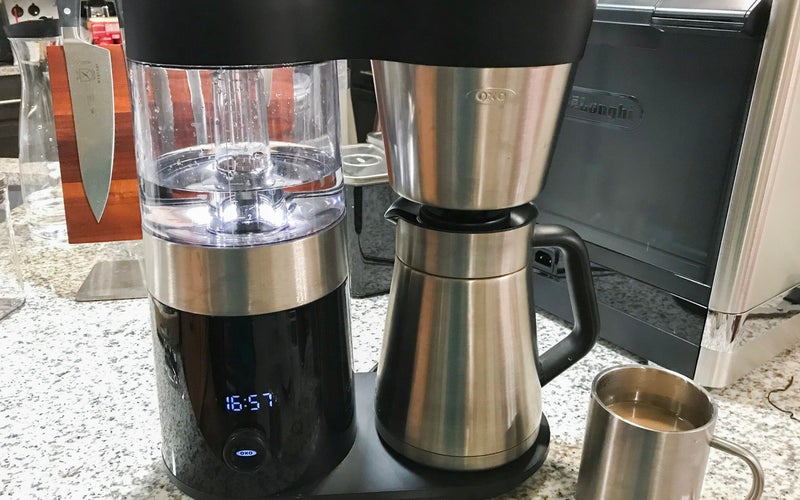 OXO 9-Cup best design curvy chrome drip coffee maker on a crowded kitchen counter