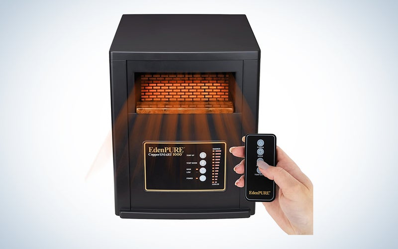 EdenPURE CopperSMART infrared heater for large rooms with a hand holding a remote control