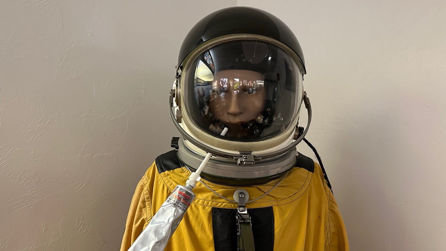 a mannequin dressed with a U-2 pilot's pressure suit and helmet