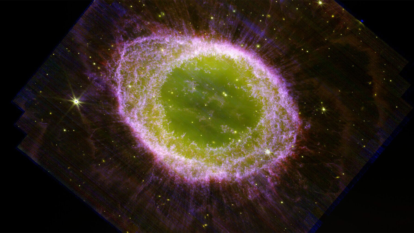 JWST/NIRcam composite image of the Ring Nebula. The image clearly shows the main ring, surrounded by a faint halo and with many delicate structures. The interior of the ring is filled with hot gas. The star which ejected all this material is visible at the very center.