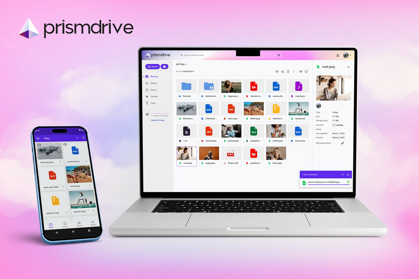 A laptop and phone showing Prismdrive on a pink and purple cloud background
