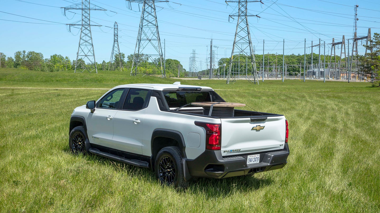 a silverado ev pickup with power lines in the background