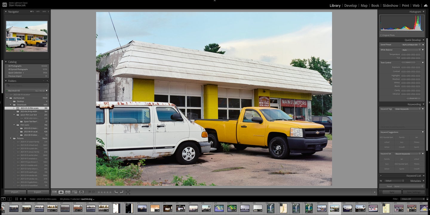 Adobe Lightroom Classic with a picture of a car lot in the edit window