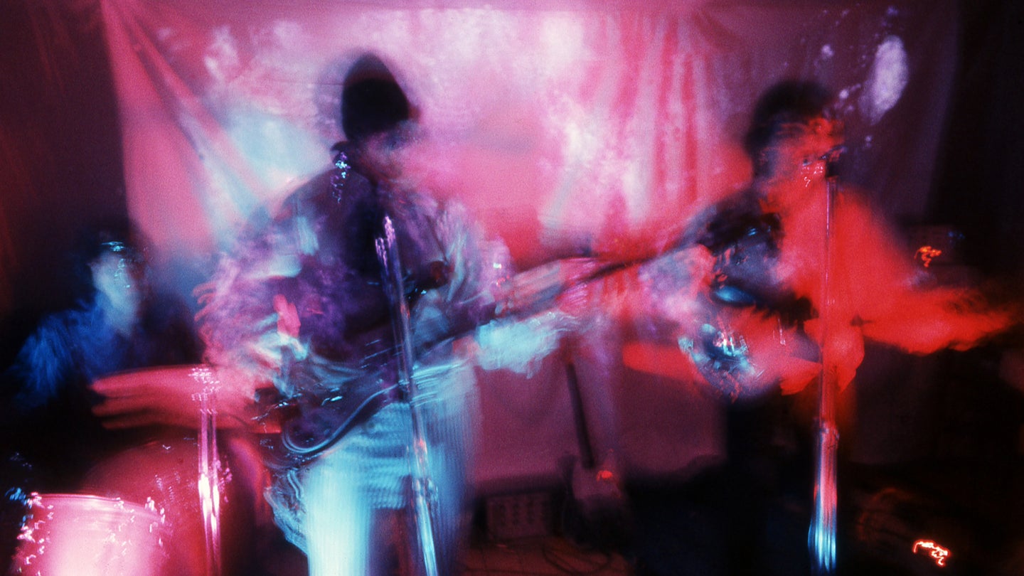 Blurry photo of Pink Floyd playing a concert