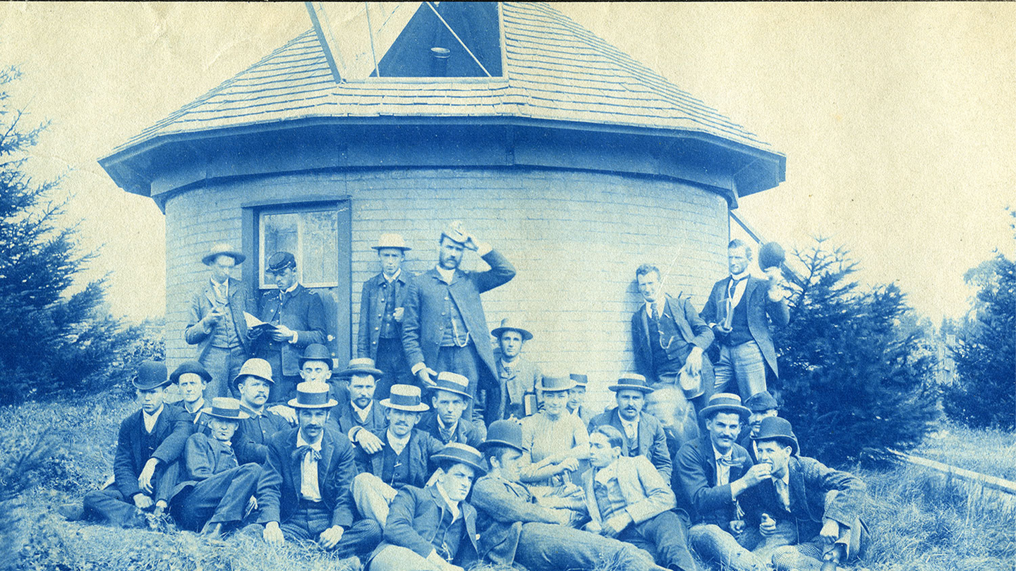 Men pose outside of Michigan State University’s first observatory, circa 1888. The observatory is located behind where Willis House now stands on MSU’s campus, just south of Grand River and north of West Circle Drive in North Neighborhood.