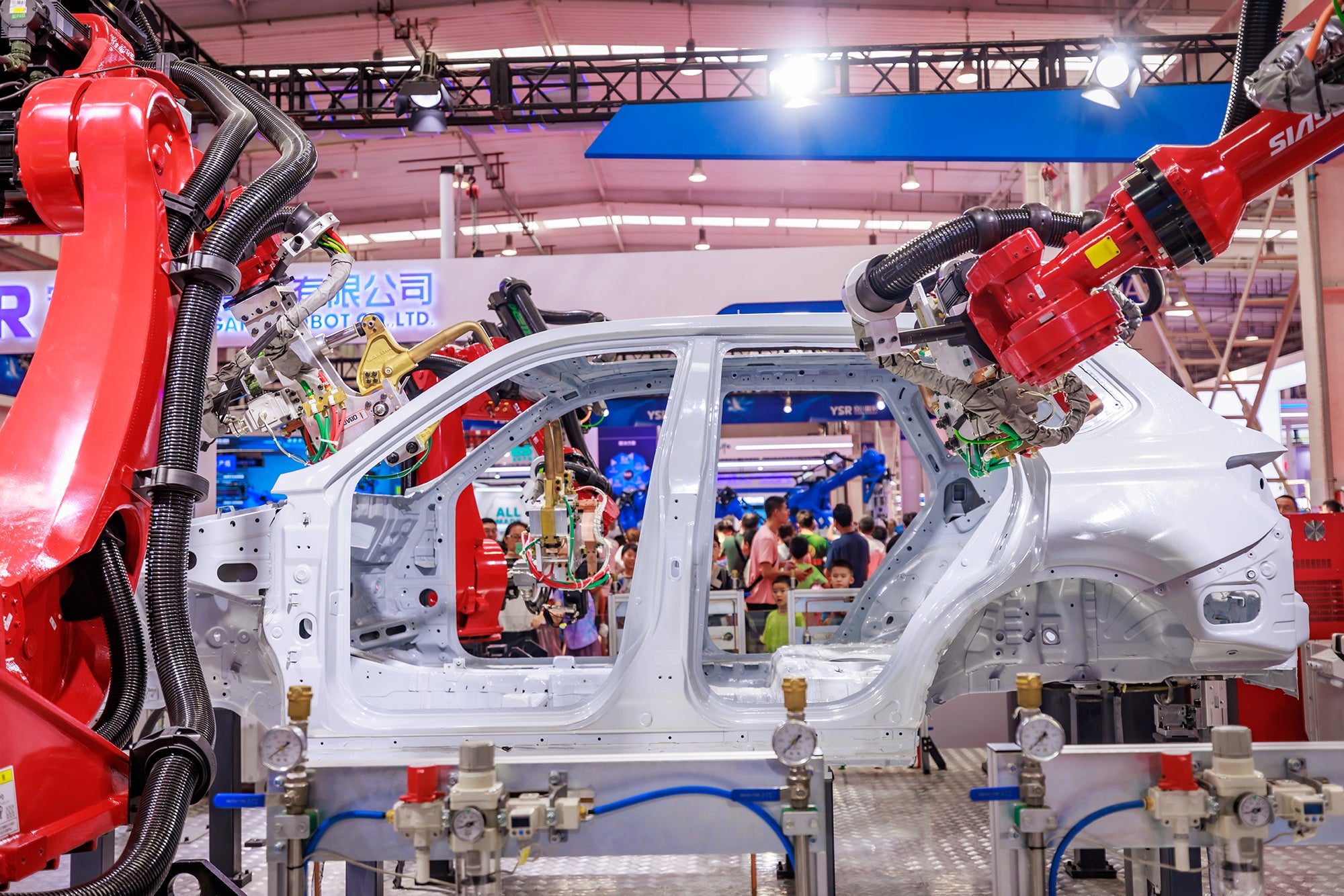 BEIJING, CHINA - AUGUST 19: Welding robots assemble a car during 2023 World Robot Conference at Beijing Etrong International Exhibition &amp; Convention Center on August 19, 2023 in Beijing, China. (Photo by Zhan Min/VCG via Getty Images)