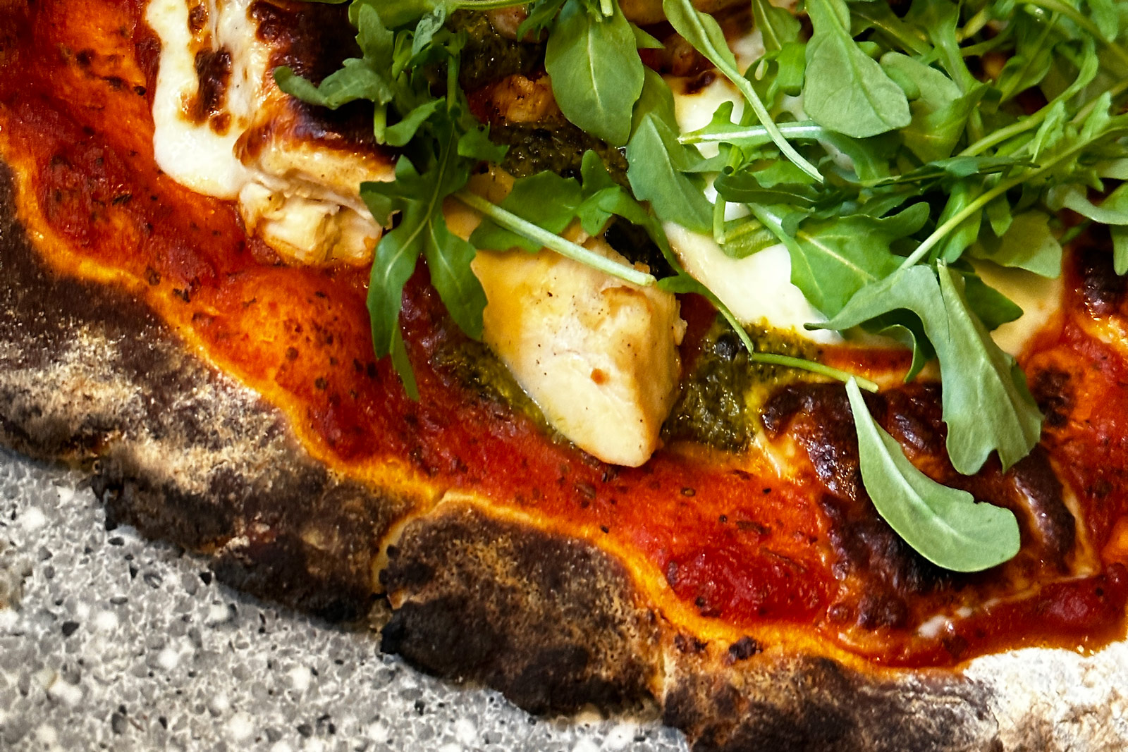 Solo Stove Pi Prime-cooked gluten free pizza with arugula and chicken.