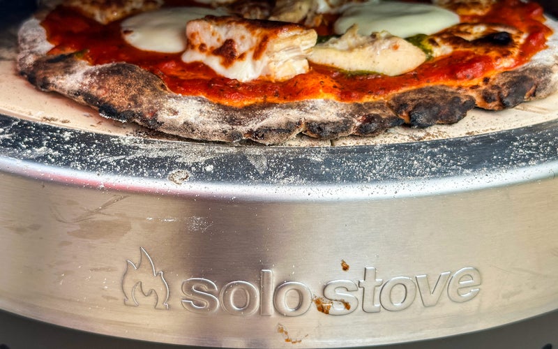 Solo Stove Pi Prime with a pizza cooking inside
