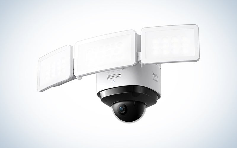 A Eufy security camera with a floodlight on a blue and white background