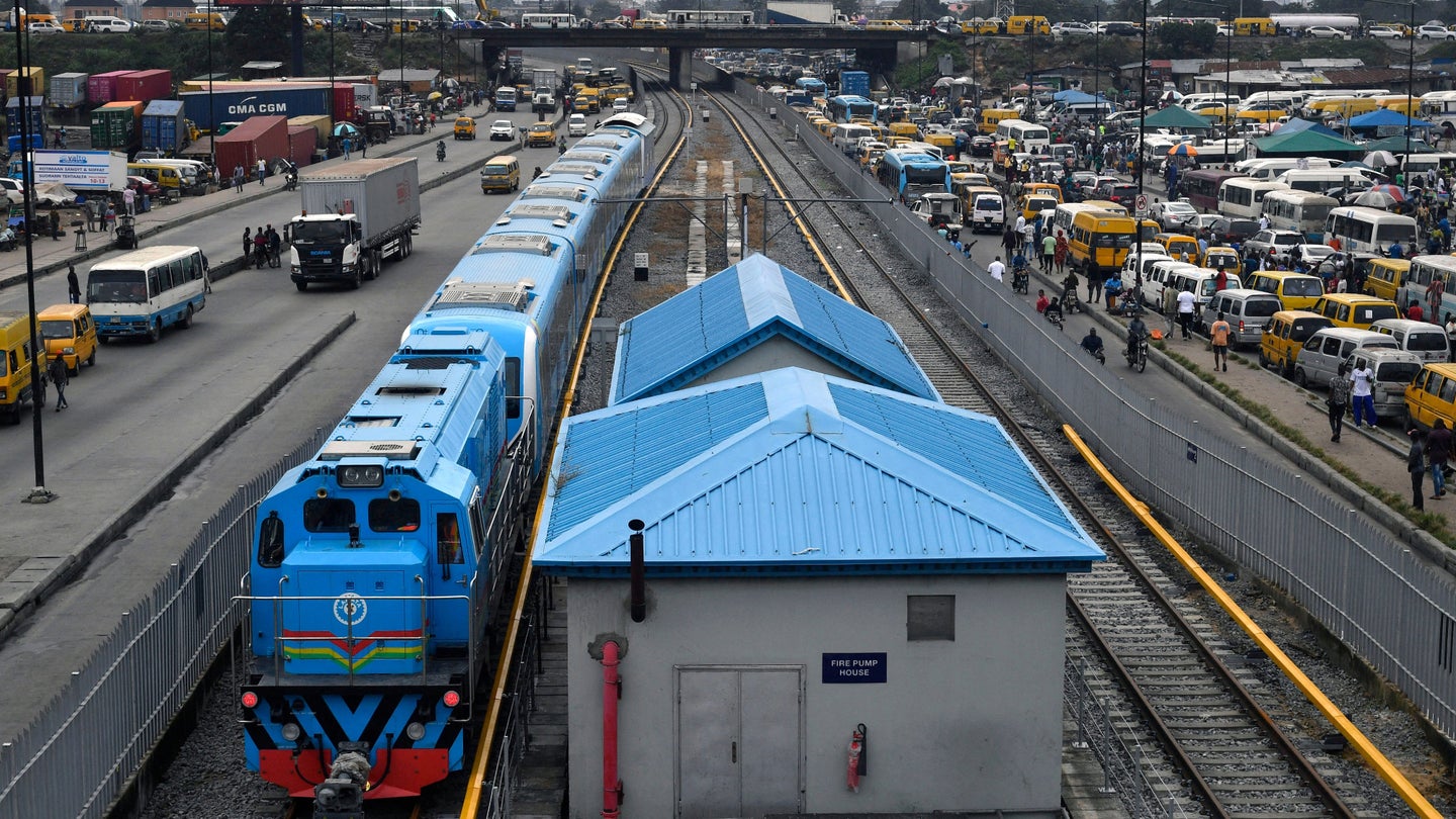 Lagos Blue Line Rail train next to traffic jam